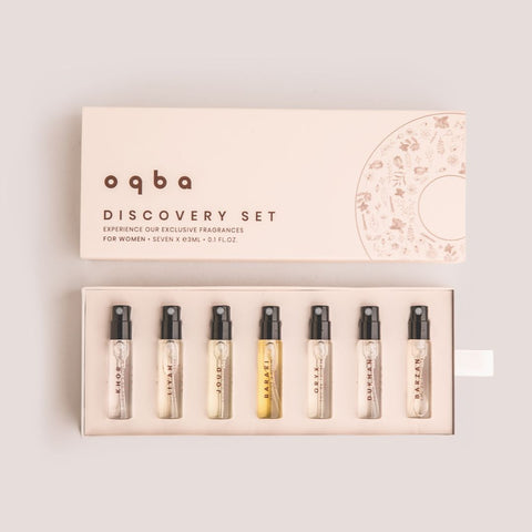 oqba discovery set with seven small perfume bottles in a box on a light background