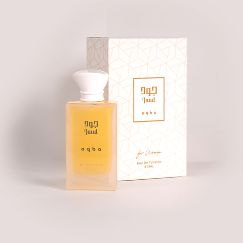 Perfume bottle and packaging with branding on a light background