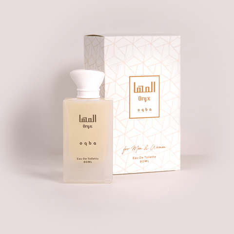 Perfume bottle and packaging with  branding on a light background